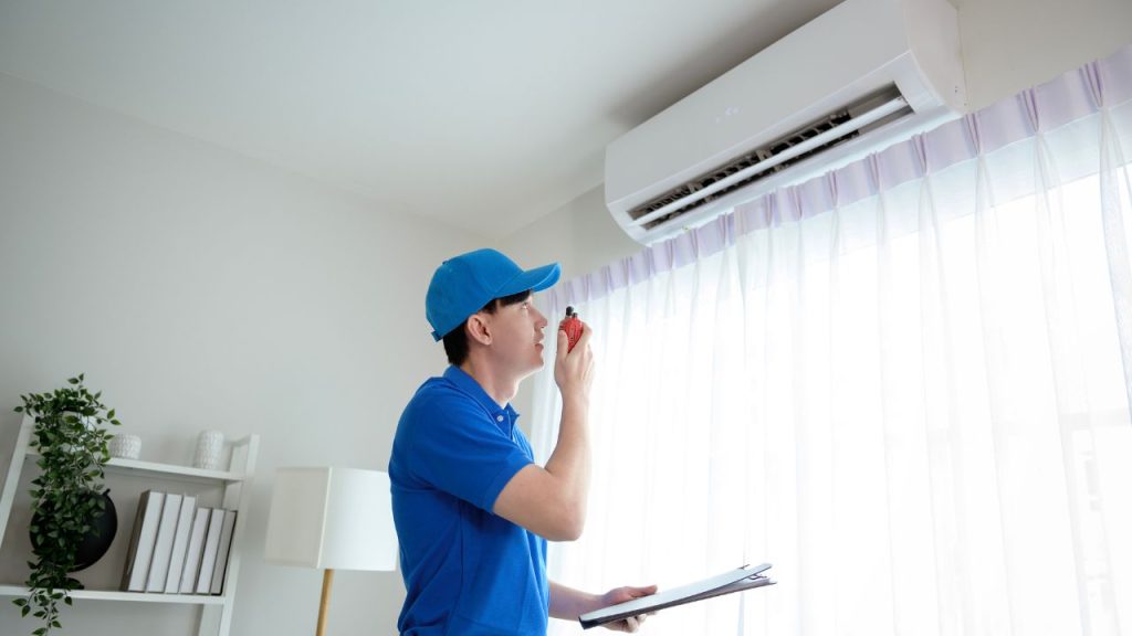an air conditioning installation technician working on a ac unit replacement