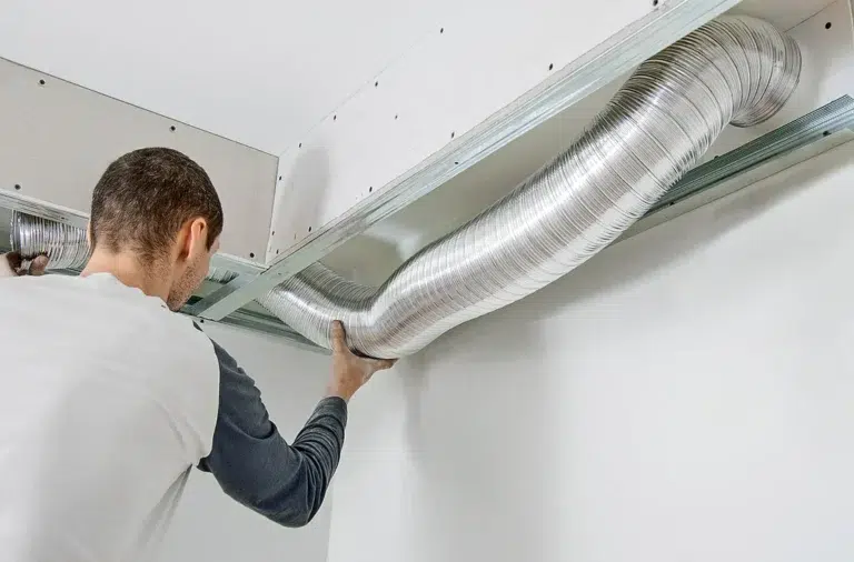 a Florida technician working on installing an air duct
