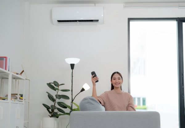 a woman with a new air conditioning unit