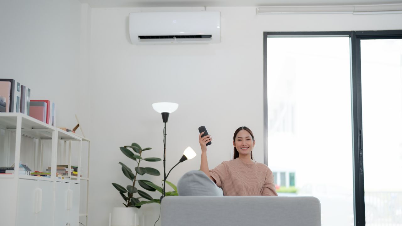 a woman with a new air conditioning unit